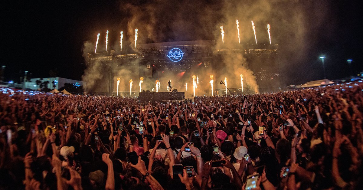 Rolling Loud Australia stage at sunset with large audience and vibrant hip-hop festival atmosphere