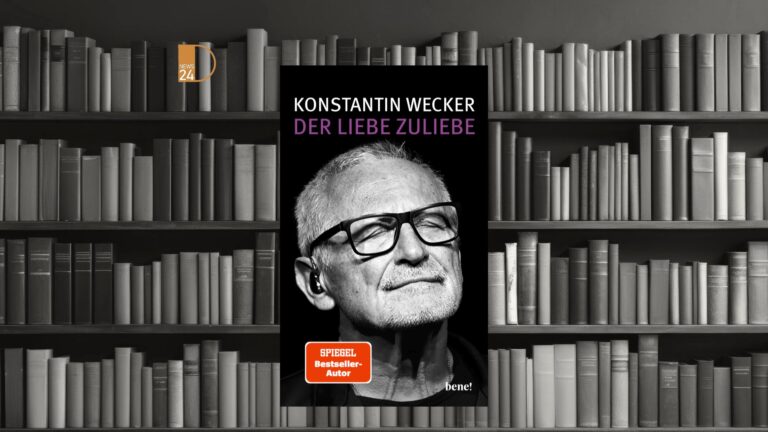 Portrait of Konstantin Wecker performing German music live on stage.