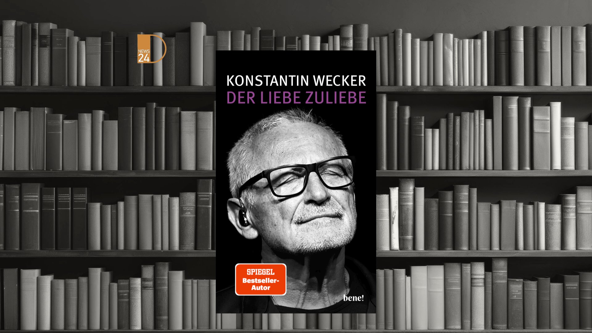 Portrait of Konstantin Wecker performing German music live on stage.