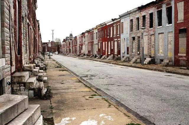 Vibrant Baltimore Inner Harbor skyline at sunset, showcasing the city's waterfront with colorful reflections on the water