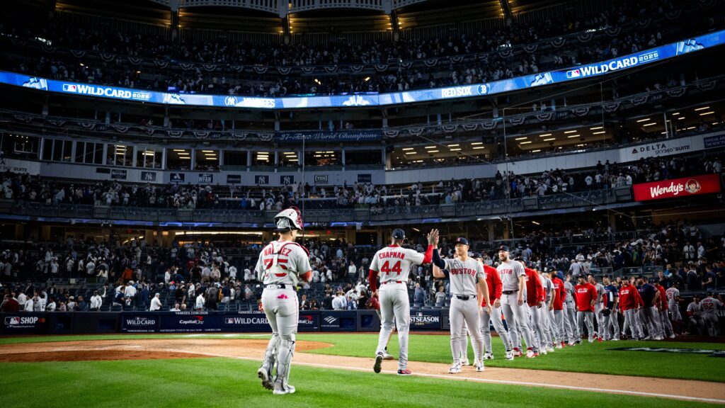 Rafael Devers swings for a double in Red Sox vs Yankees AL Wild Card Game 1 2025