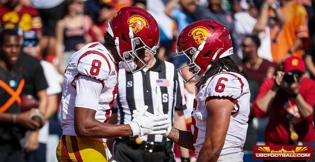 USC running back King Miller sprints past Michigan defenders in a 2025 Michigan vs USC Football game.