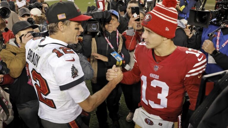 Baker Mayfield scrambles for a first down, evading defenders in the 49ers vs Buccaneers game on October 12, 2025.