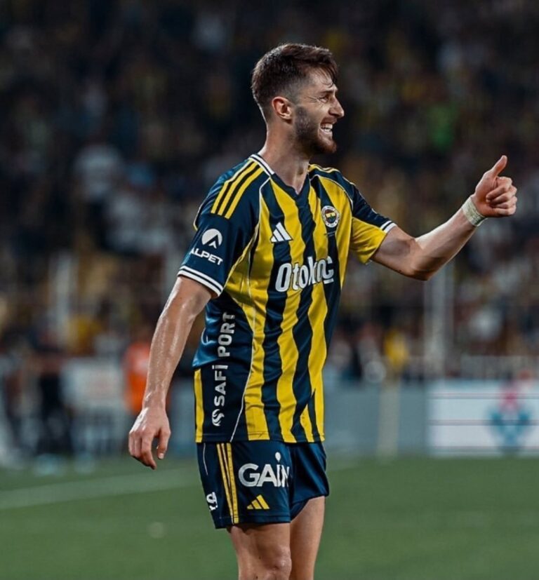 Edson Álvarez, Mexican professional footballer, in action during a match, wearing his team’s kit with focused expression, demonstrating defensive skills on the field