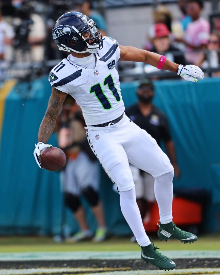 Lumen Field, home of the Seattle Seahawks" Alt Text: A vibrant exterior view of Lumen Field stadium in Seattle, Washington, with its modern architecture and signage, home to the Seattle Seahawks NFL team.