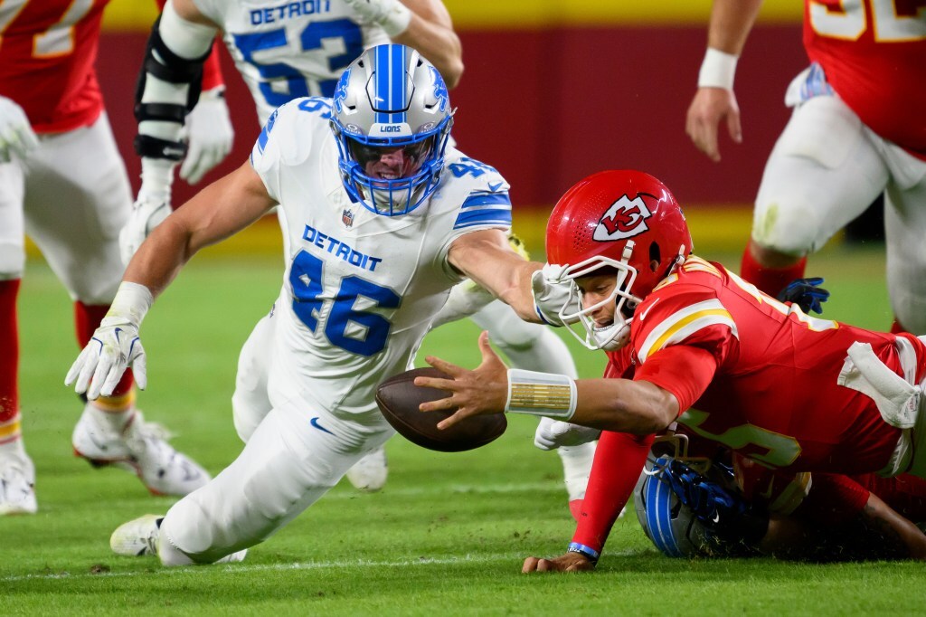 Patrick Mahomes throws a touchdown pass under pressure in the Chiefs vs Lions game on October 12, 2025.