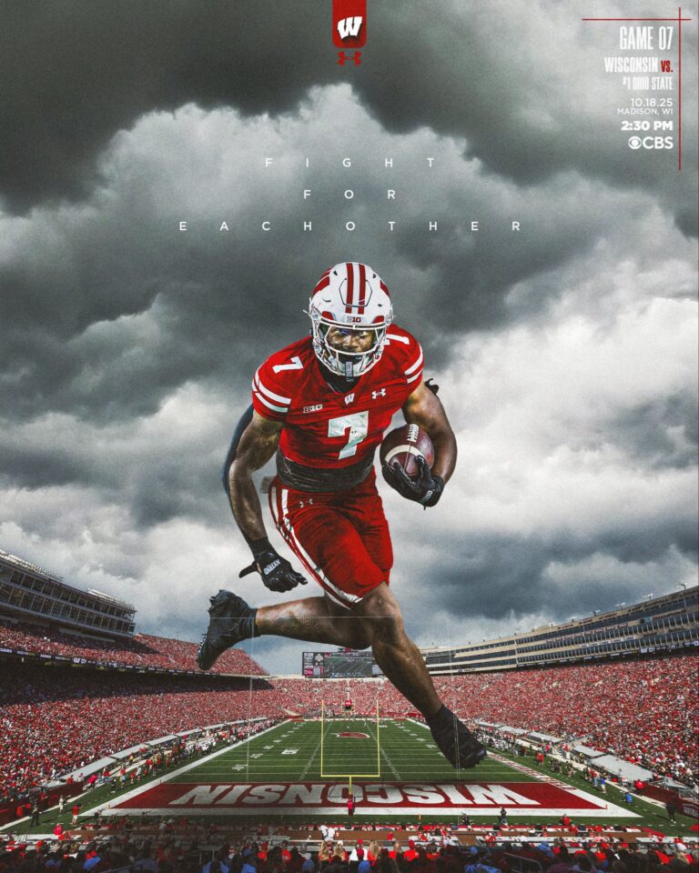 Quarterback leading Ohio State vs Wisconsin rivalry game action.