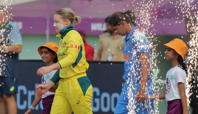 Australia vs India women cricket teams competing in an intense match highlighting skill, teamwork, and sportsmanship.