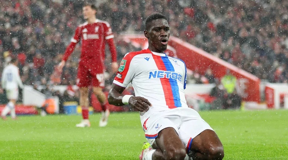Liverpool vs Crystal Palace players battling for possession during a Premier League match at Anfield
