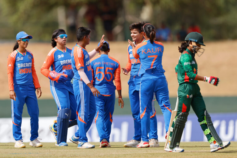 Bangladesh vs India women cricket teams competing in an international match, with players showing team spirit and fans cheering in the stadium