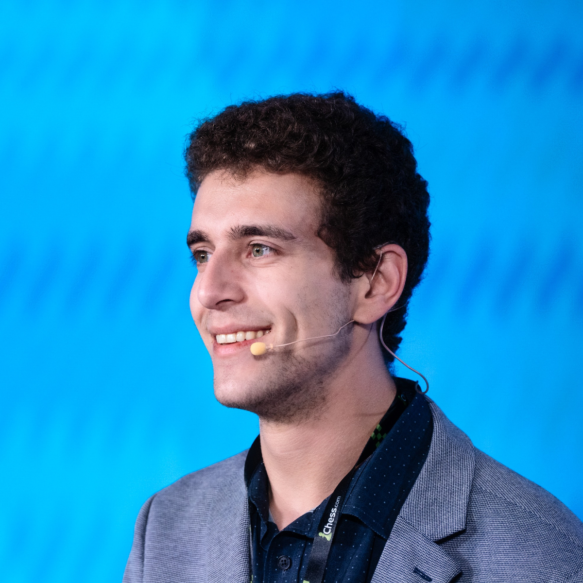 Daniel Naroditsky, young American chess grandmaster and educator, analyzing a chess game during a tournament or live stream
