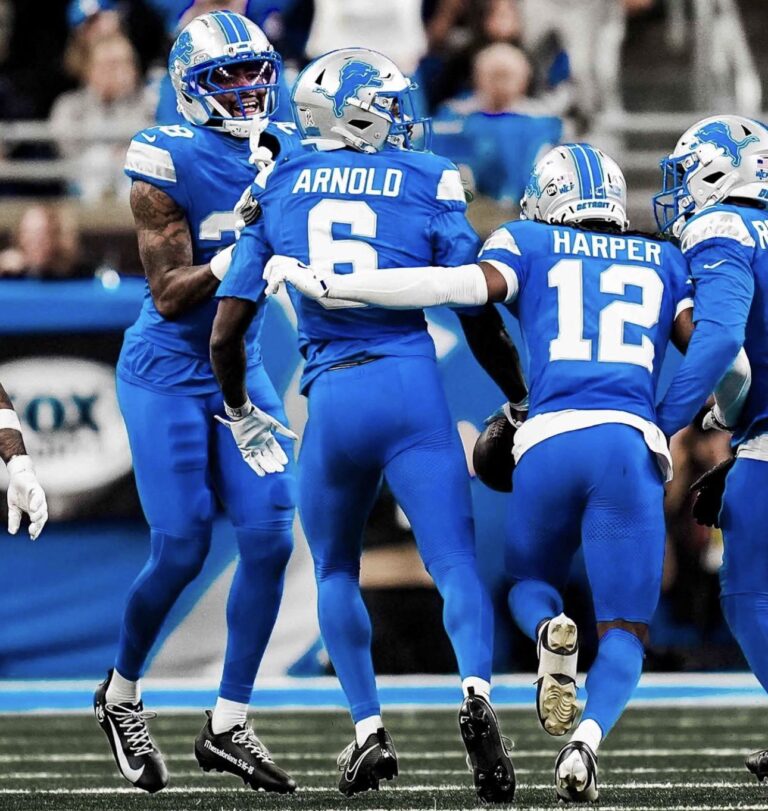 Vikings vs Lions football matchup at Ford Field, showcasing rivalry intensity and team spirit.