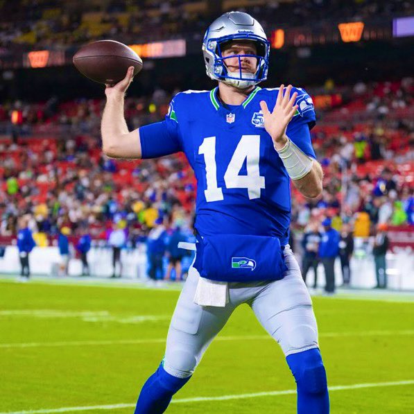 Seahawks vs Commanders players battle for possession in this epic NFL matchup